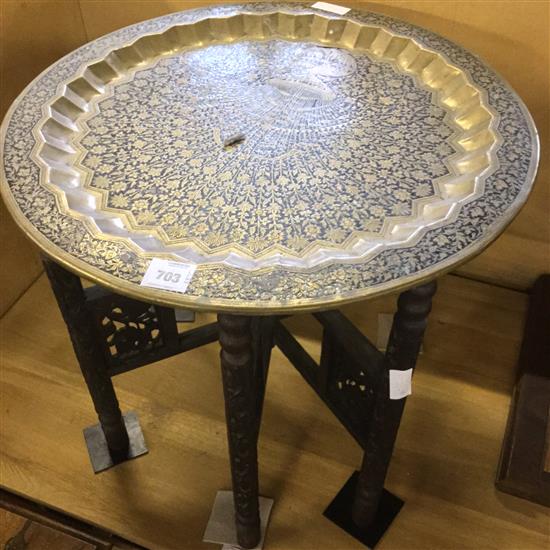 Circular Indian brass and lacquer tray top table on carved stand(-)